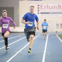 man and woman running on track